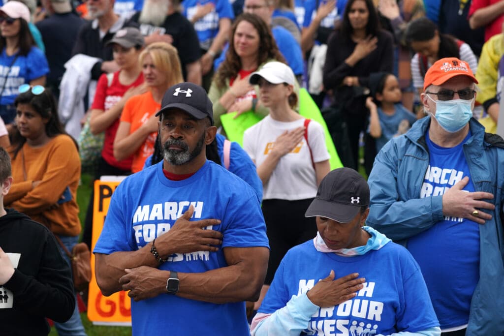 Participants observe a moment of silence