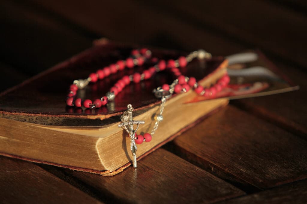 A Bible with a rosary
