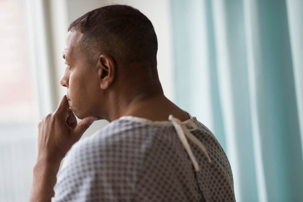 A man in a medical gown