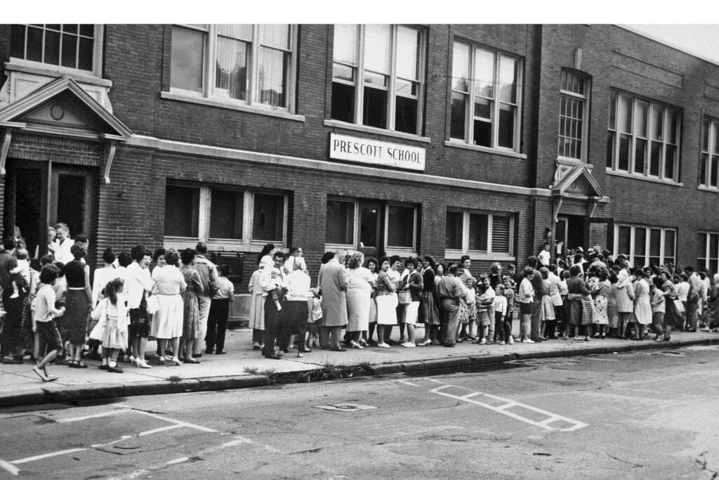 Parents and their children wait in long lines o receive the Sabin oral polio vaccine in 1961
