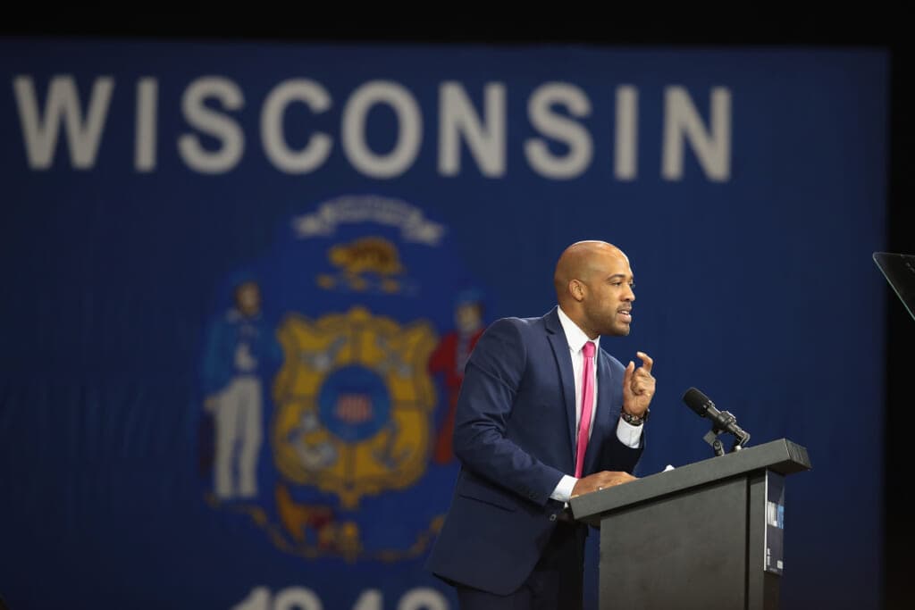 Democratic candidate for Lieutenant Governor of Wisconsin Mandela Barnes leans on a podium