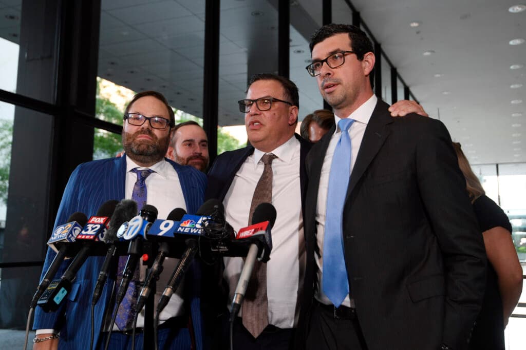 Attorney Beau Brindley, Derrel McDavid and attorney Vadim Glozman