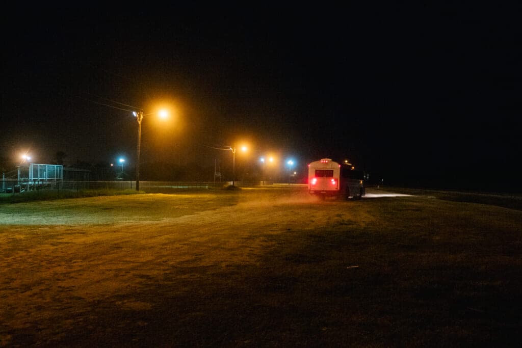 Migrants are taken to a border patrol processing facility after crossing the Rio Grande