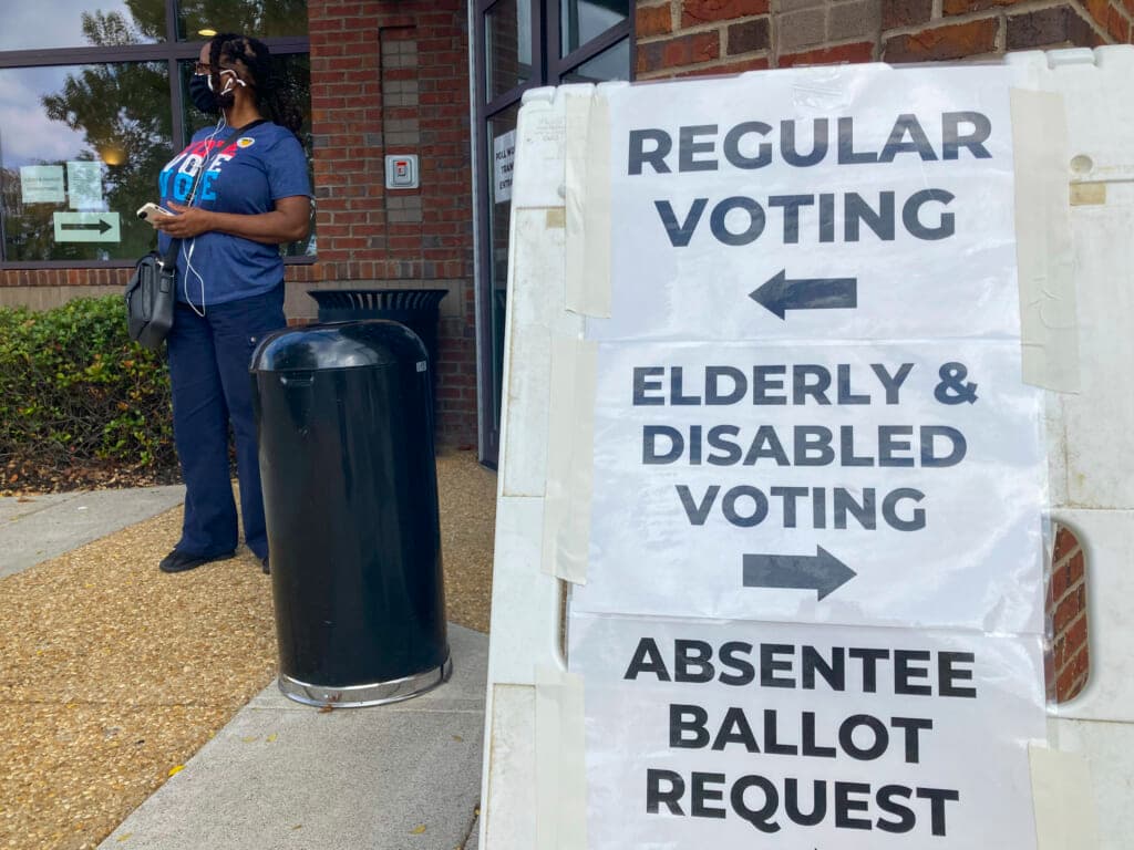 Signs showing the way for voters outside a Cobb County voting building
