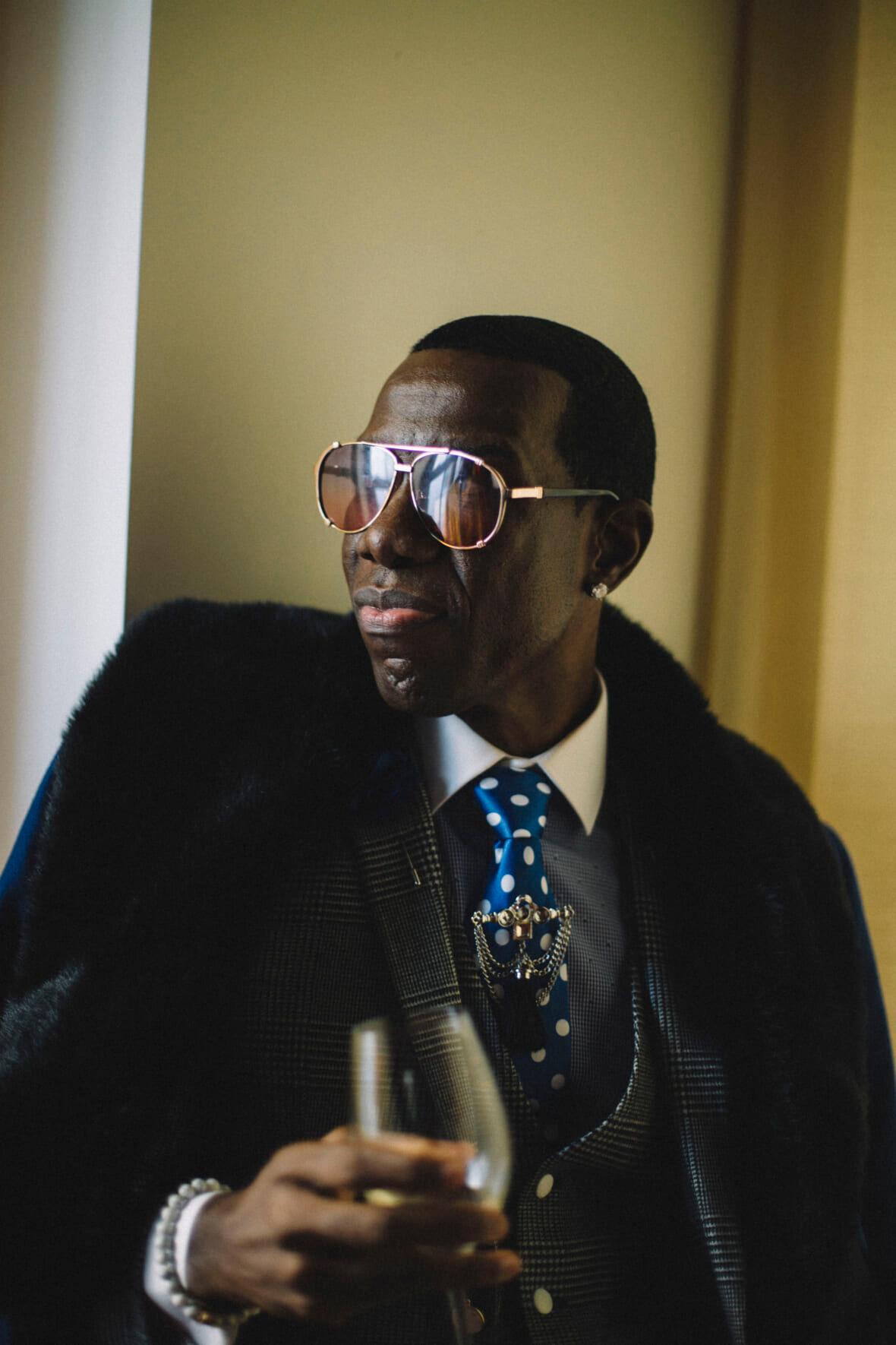 A man poses for a portrait during a Harlem Fashion Row event