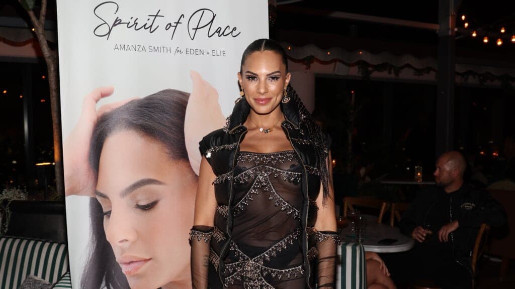 Reality TV star Amanza Smith wearing a sheer black dress