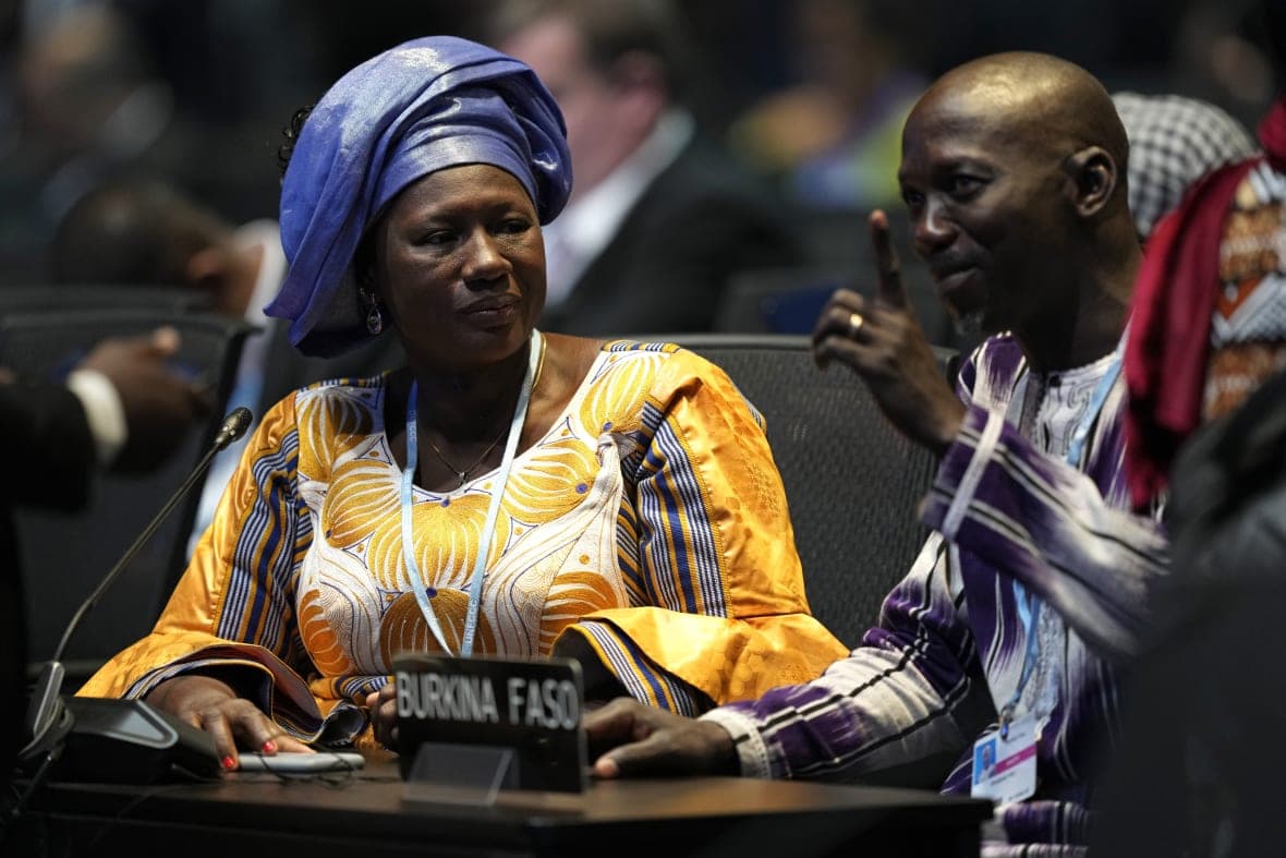 Delegates attend an opening session