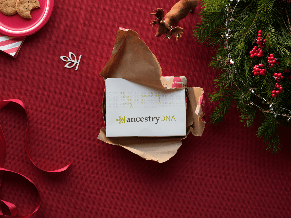 An unwrapped present containing an Ancestry DNA kit