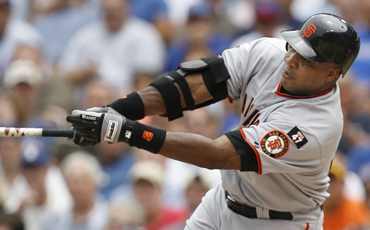 Barry Bonds of the San Francisco Giants swings his bat, wearing his Giants uniform and black batting helmet