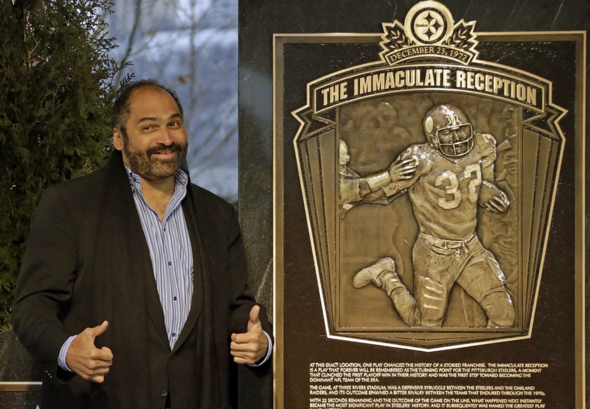 Hall of Fame running back, Pittsburgh Steelers’ Franco Harris and a plaque about his accomplishments
