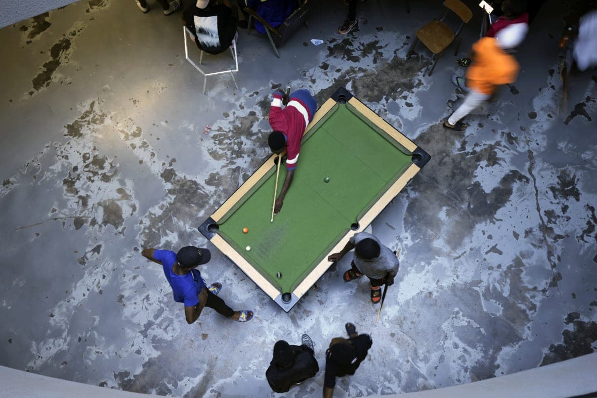 People play pool in Harare, capital of Zimbabwe