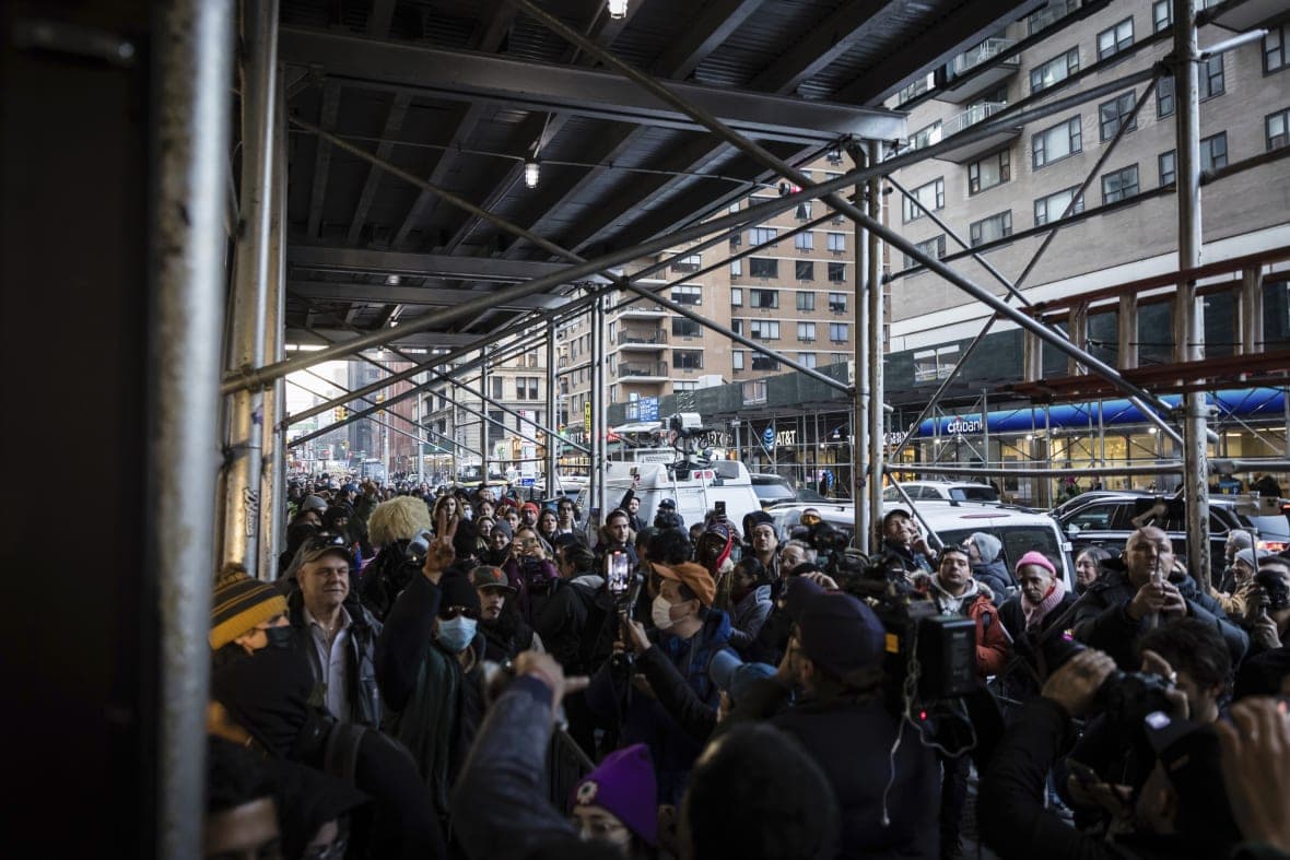 A crowded line of people wait to enter Housing Works Cannabis Co.