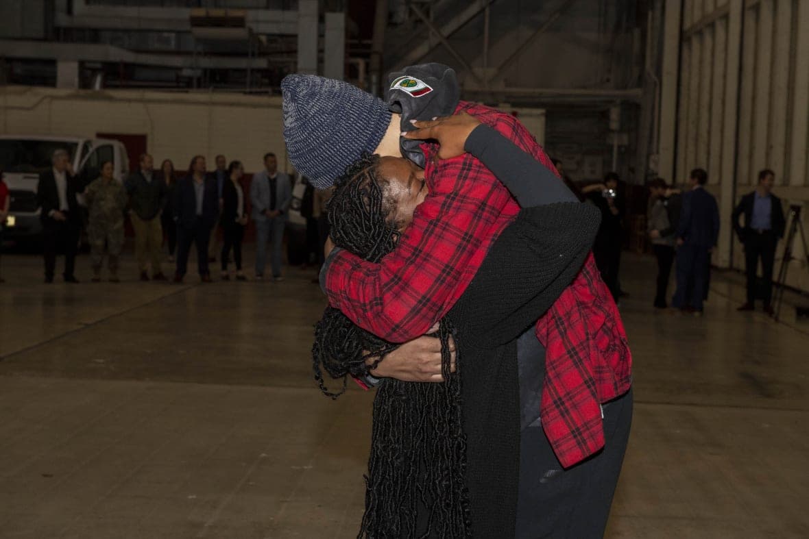 Basketball player Brittney Griner embraces her wife Cherelle Griner
