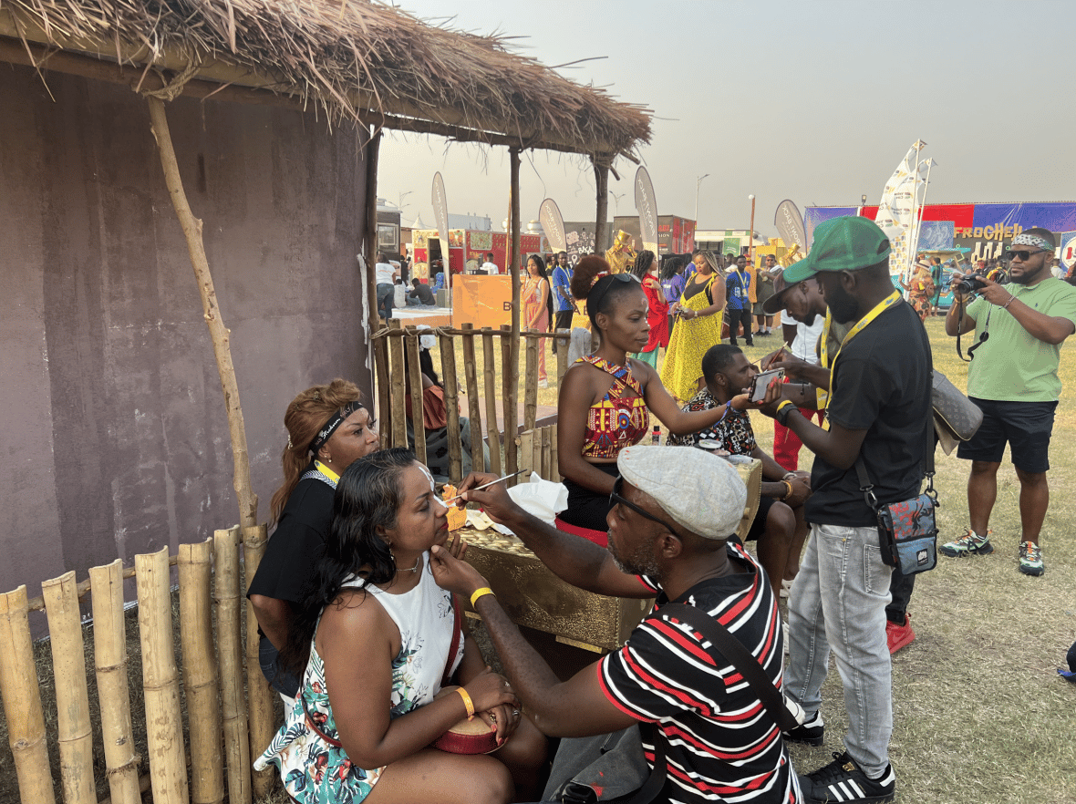 Attendees get their faces painted at the 2022 Afrochella Festival