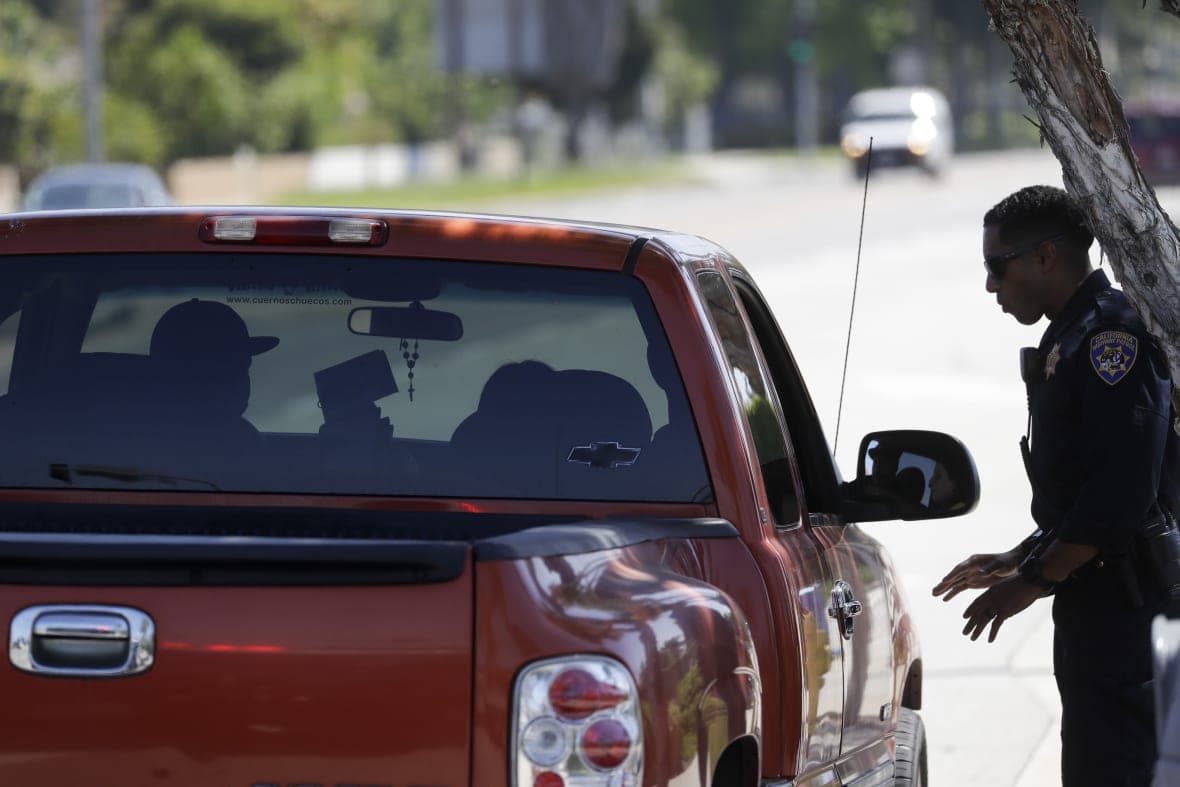 A California Highway Patrol officer stops a motorist