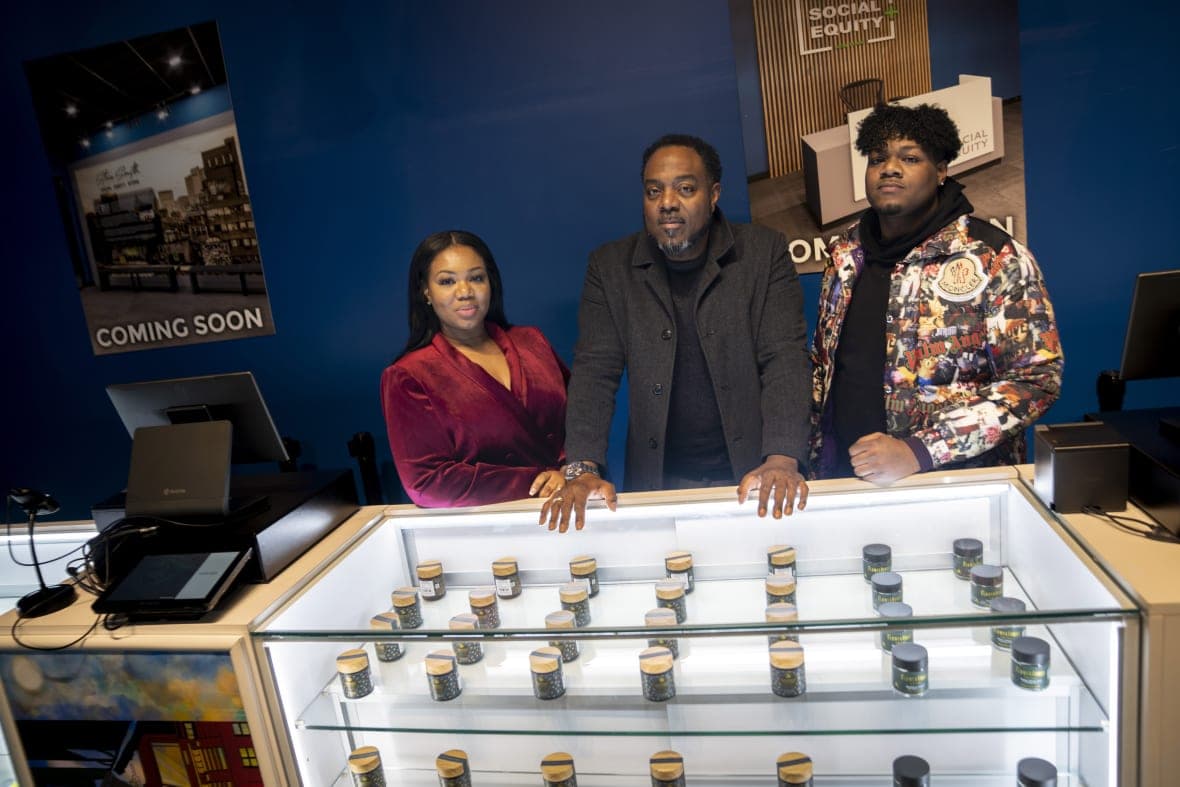 Roland Conner, son Darius and wife Patricia at their cannabis dispensary
