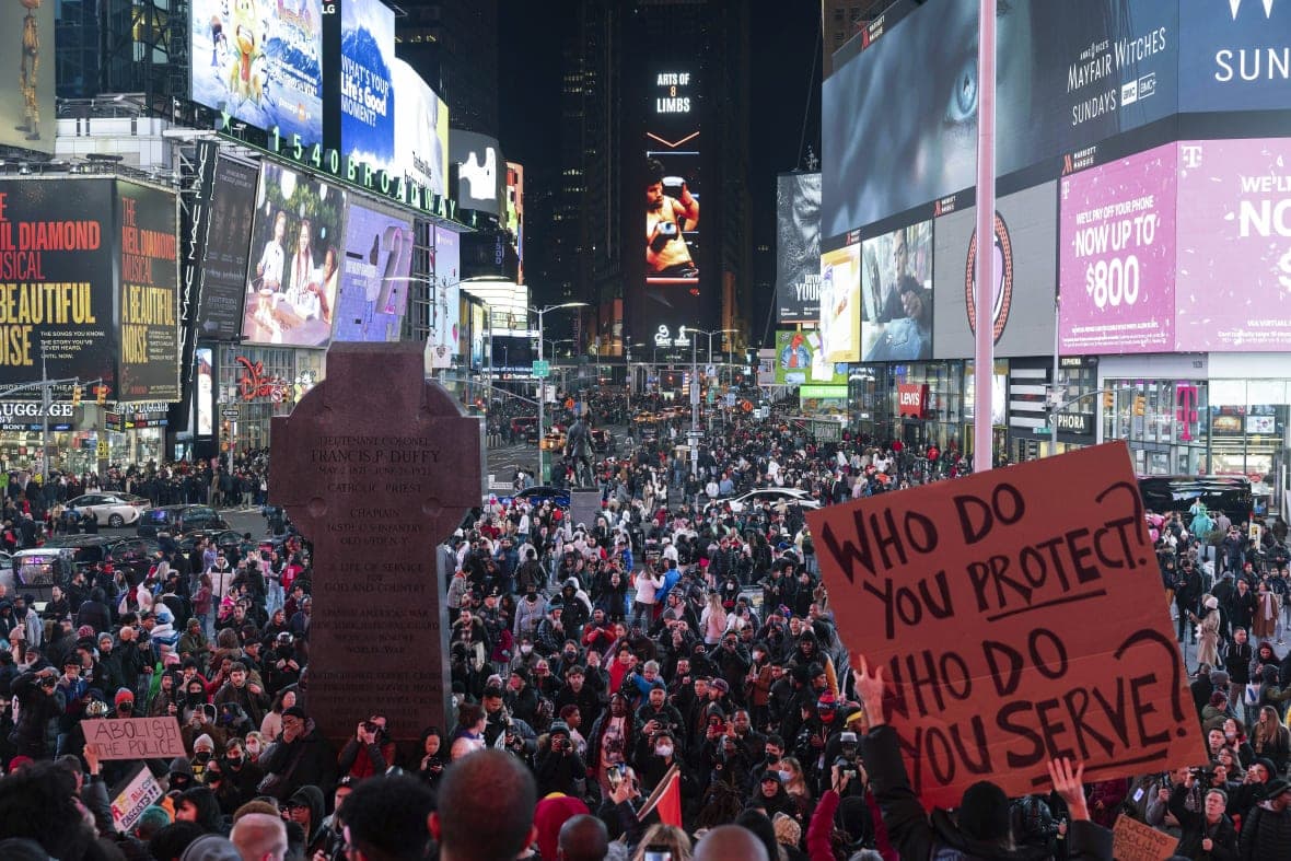 Demonstrators gather during a protest in Times Square