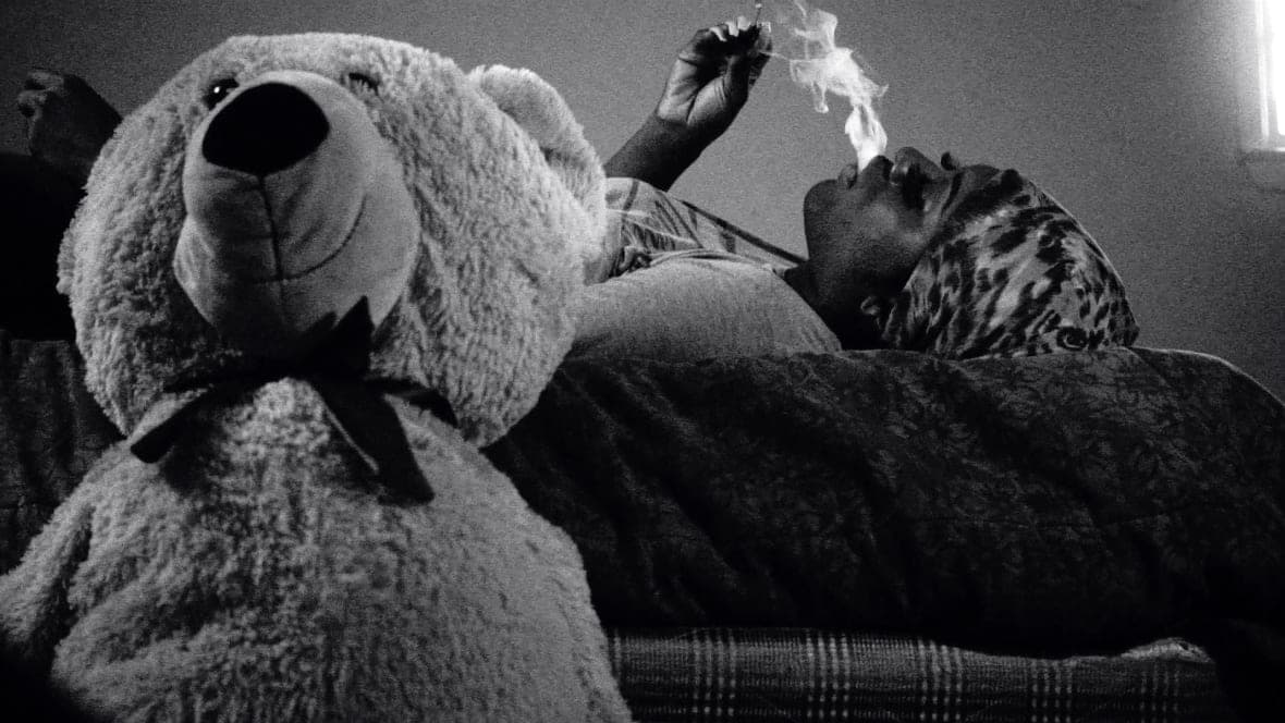Liyah Mitchell has a smoke in a scene from “Kokomo City”