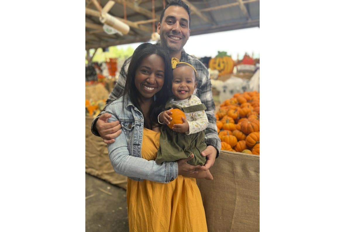 Andy Giron with his wife, Alana Giron, and infant daughter