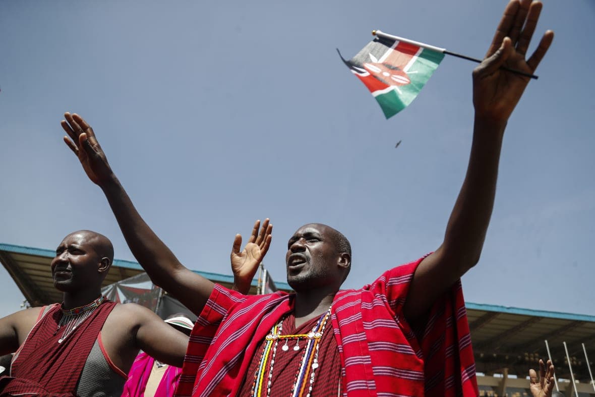 A Maasai man joins others at a national day of prayer event in Kenya