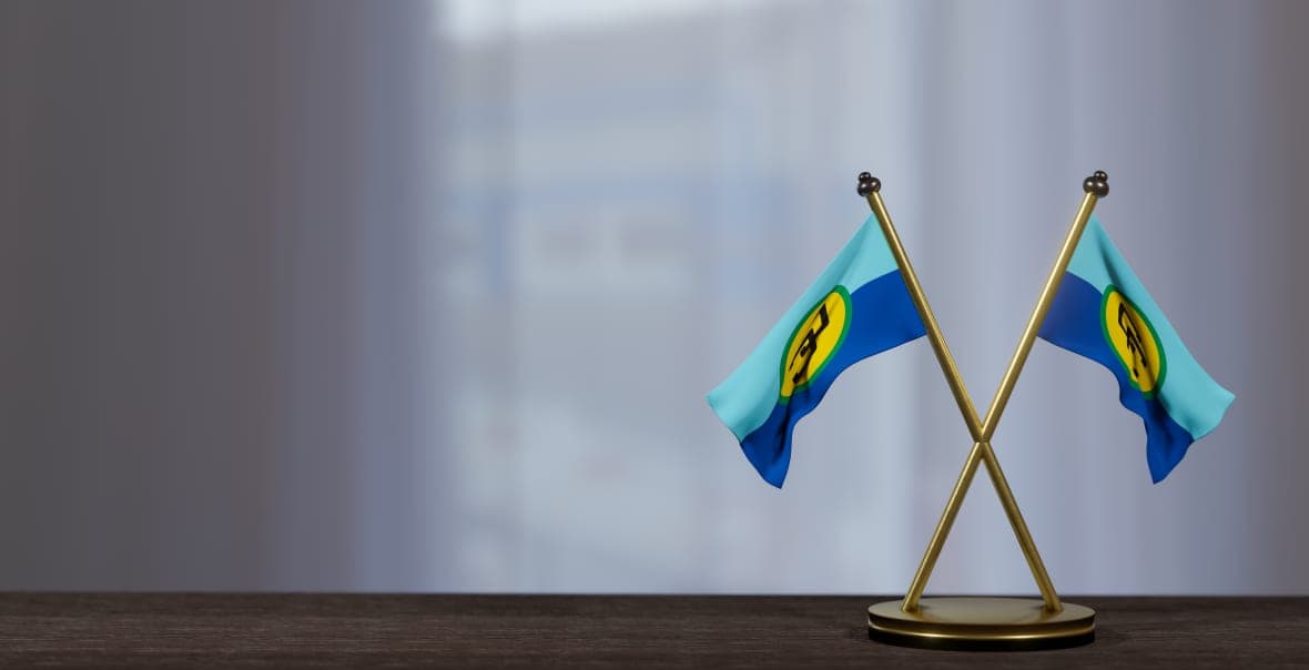 CARICOM flags on a negotiating table