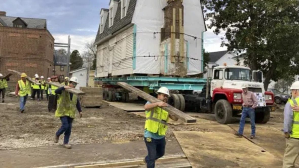 Workers prepare to move the oldest schoolhouse in the U.S. for Black children