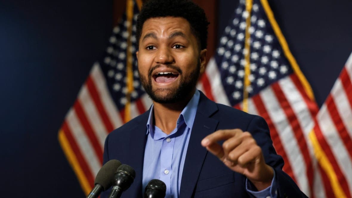 Democratic Representative Maxwell Frost of Florida in a blue shirt and navy jacket