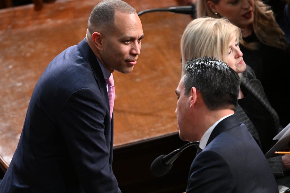House Minority Leader Hakeem Jeffries of New York speaks to Democratic Representative Pete Aguilar of California