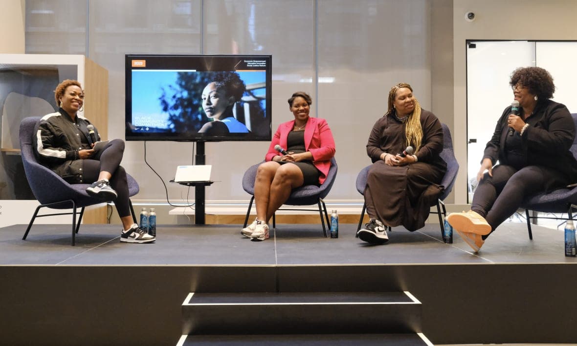 Nike Senior Director of Inclusive Community for Social & Community Impact Karol Collymore moderating a panel