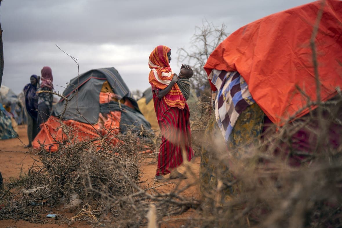 A Somali woman breastfeeds her child