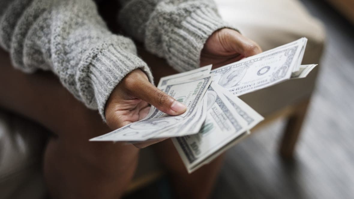 Hands holding money