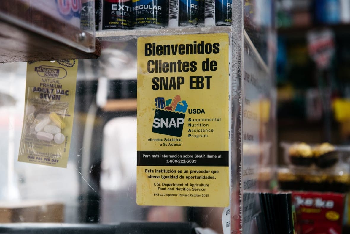 A sign alerting customers about SNAP food stamps benefits