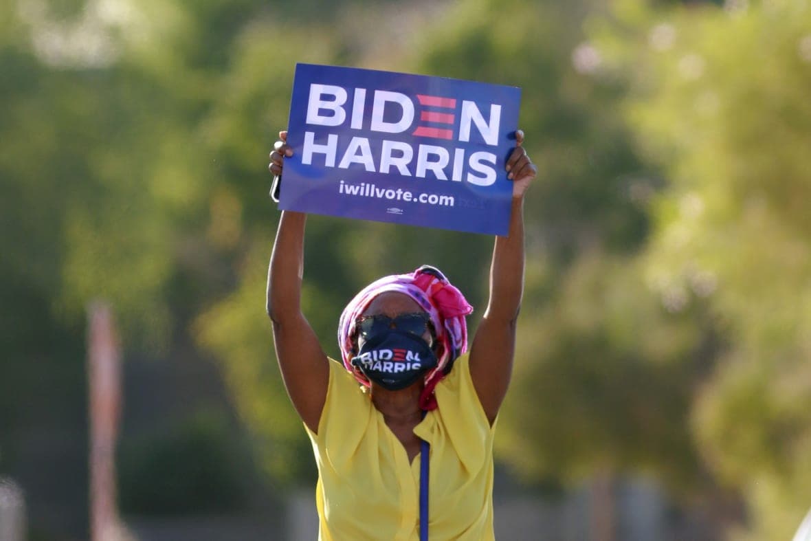 Supporter Stephanie Smith holds up a sign