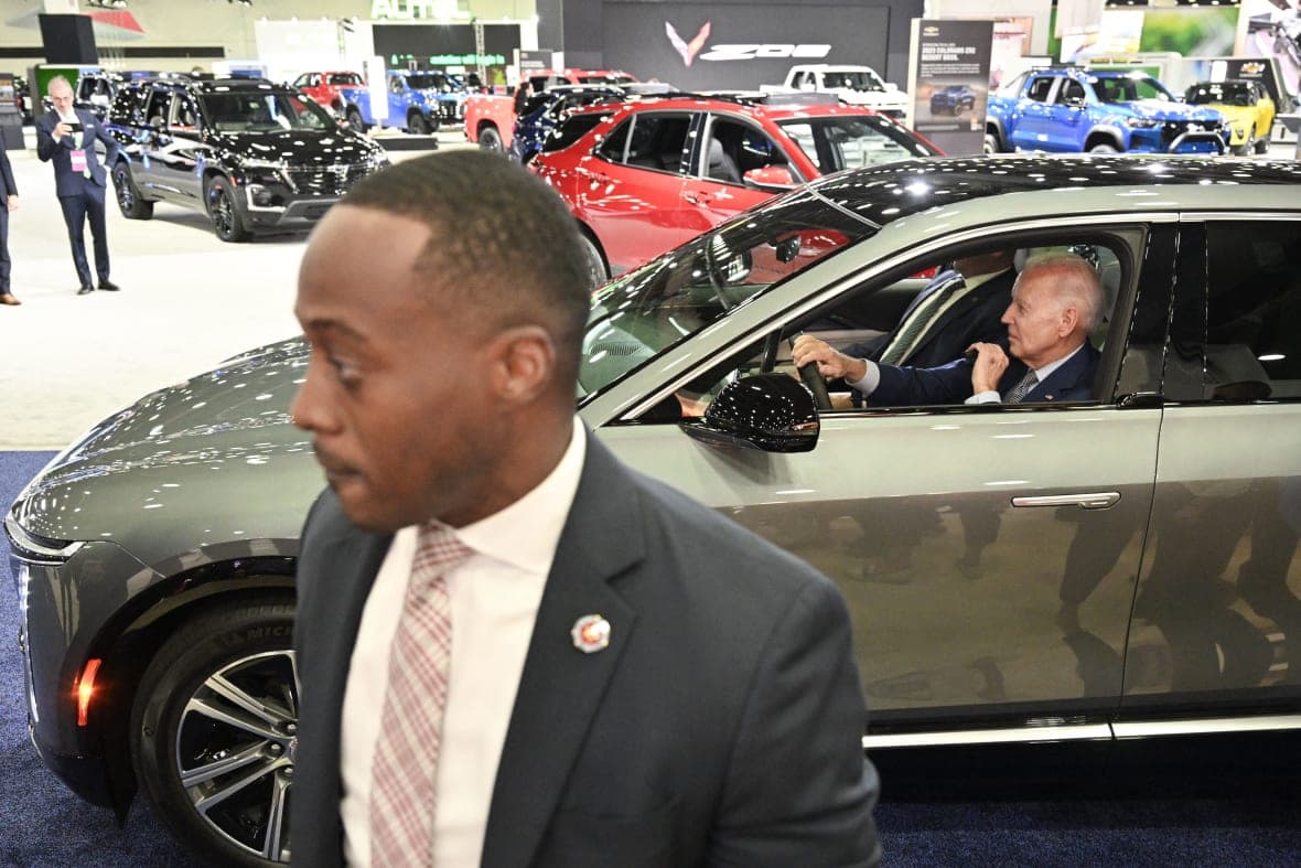 President Joe Biden in an electric vehicle