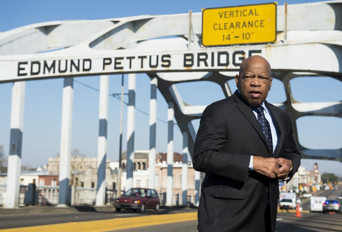 Rep. John Lewis, D-Ga., stands on the Edmund Pettus Bridge