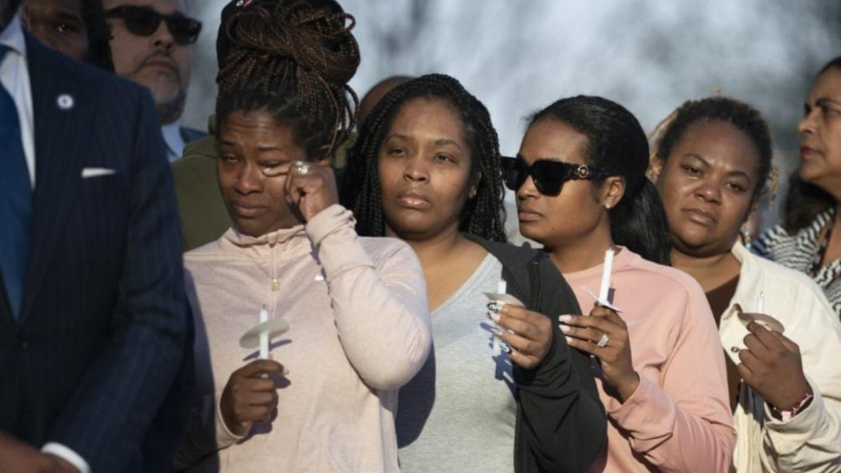 A mourner wipes away a tear during the "Nashville Remembers" candlelight vigil