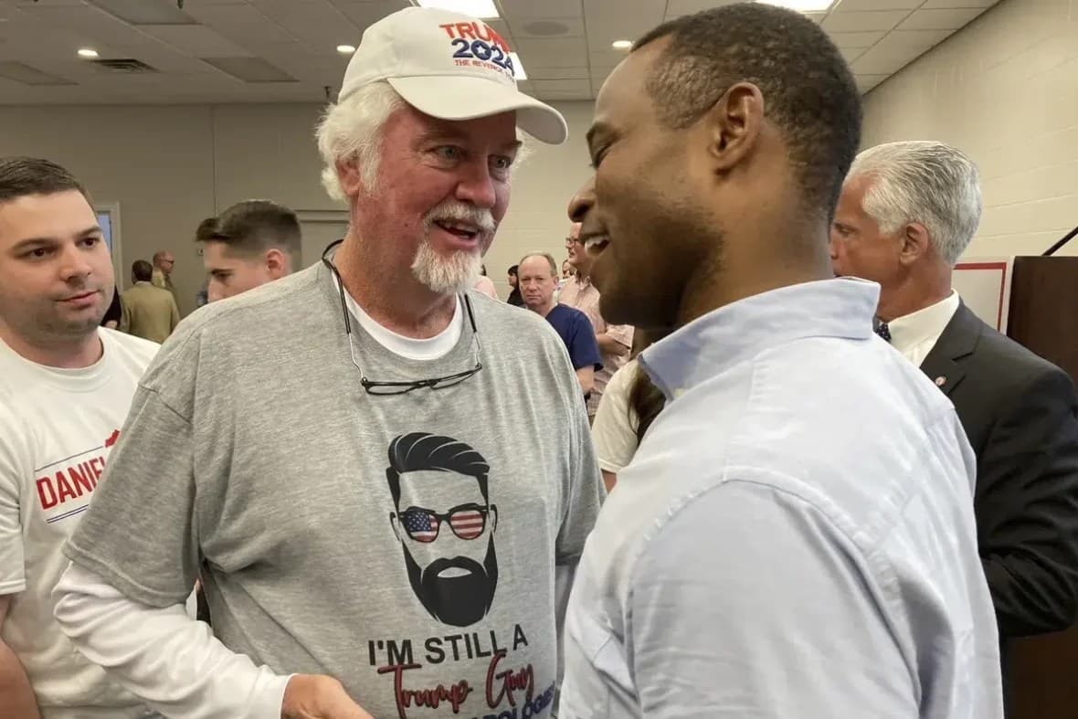 Republican gubernatorial candidate Daniel Cameron, right, chats with supporters
