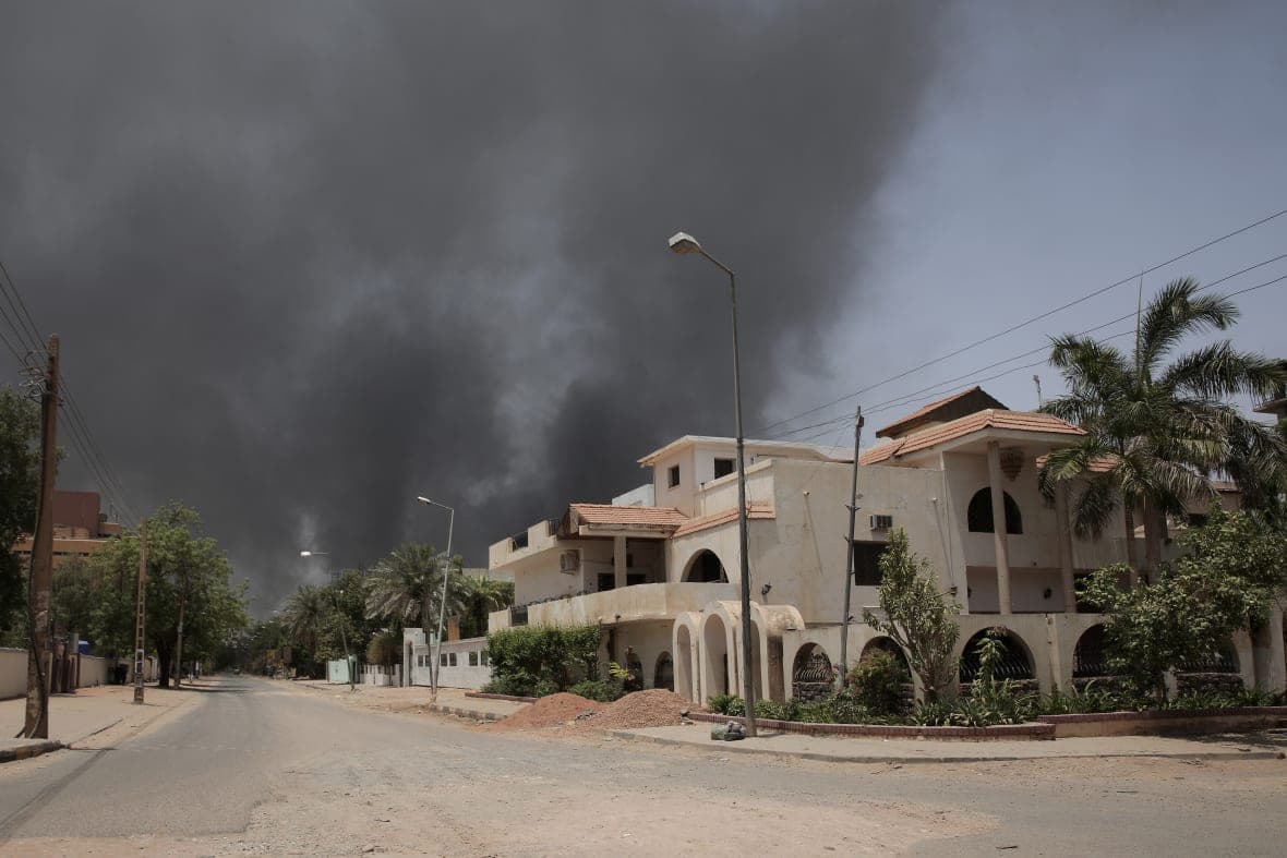 Smoke is seen rising from a neighborhood
