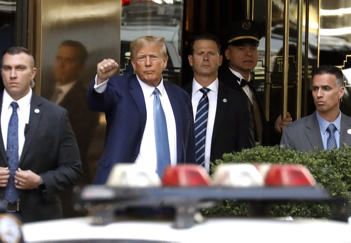 Former President Donald Trump raises a fist