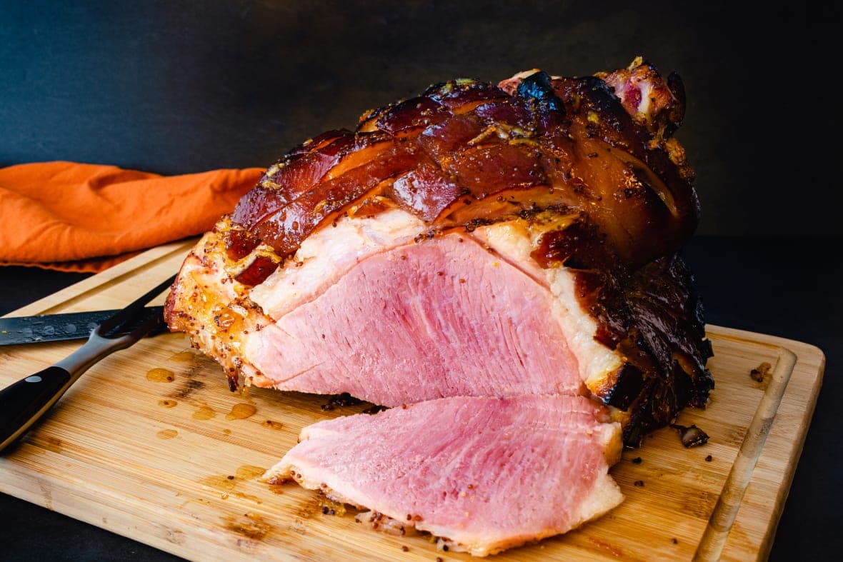 Glazed ham on a cutting board