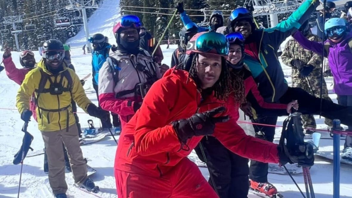 Quincy “Q” Shannon and his program participants embrace the mountaintop in Denver