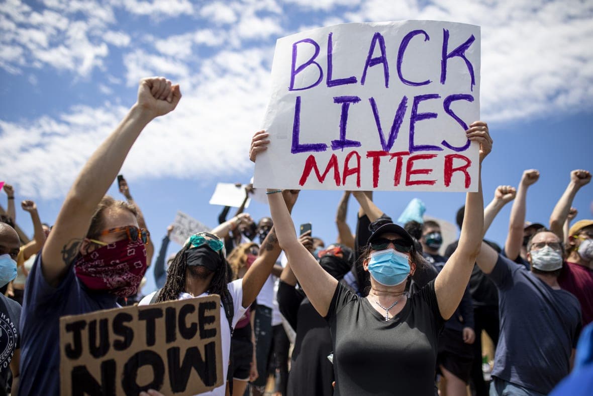 People gather along the steps of the Philadelphia Art Museum during a Justice for George Floyd protest