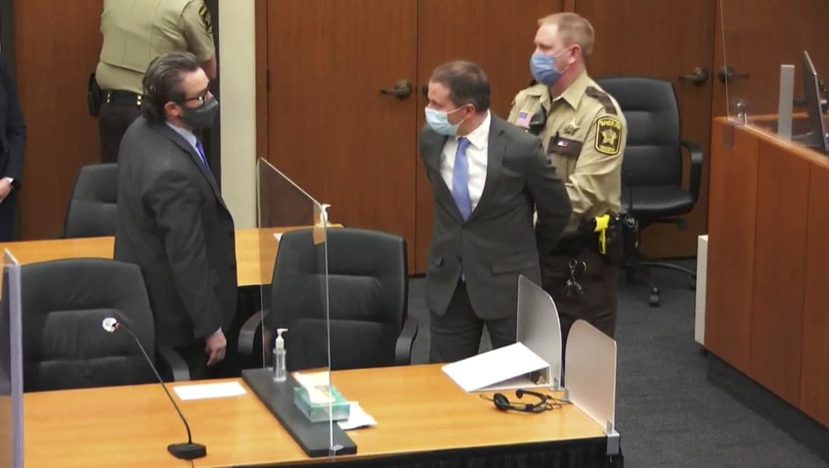 Attorney Eric Nelson looks on as his client, former Minneapolis Police Officer Derek Chauvin, is taken into custody