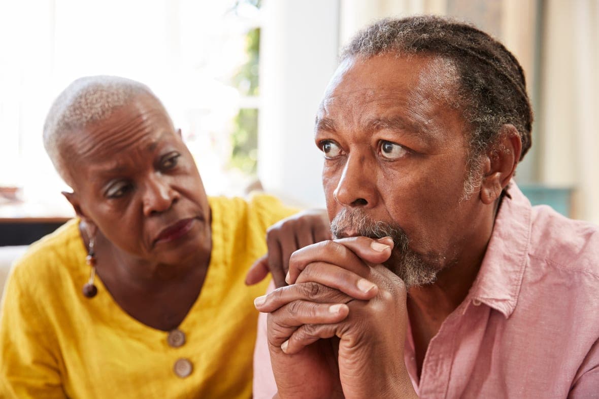An older couple looking concerned