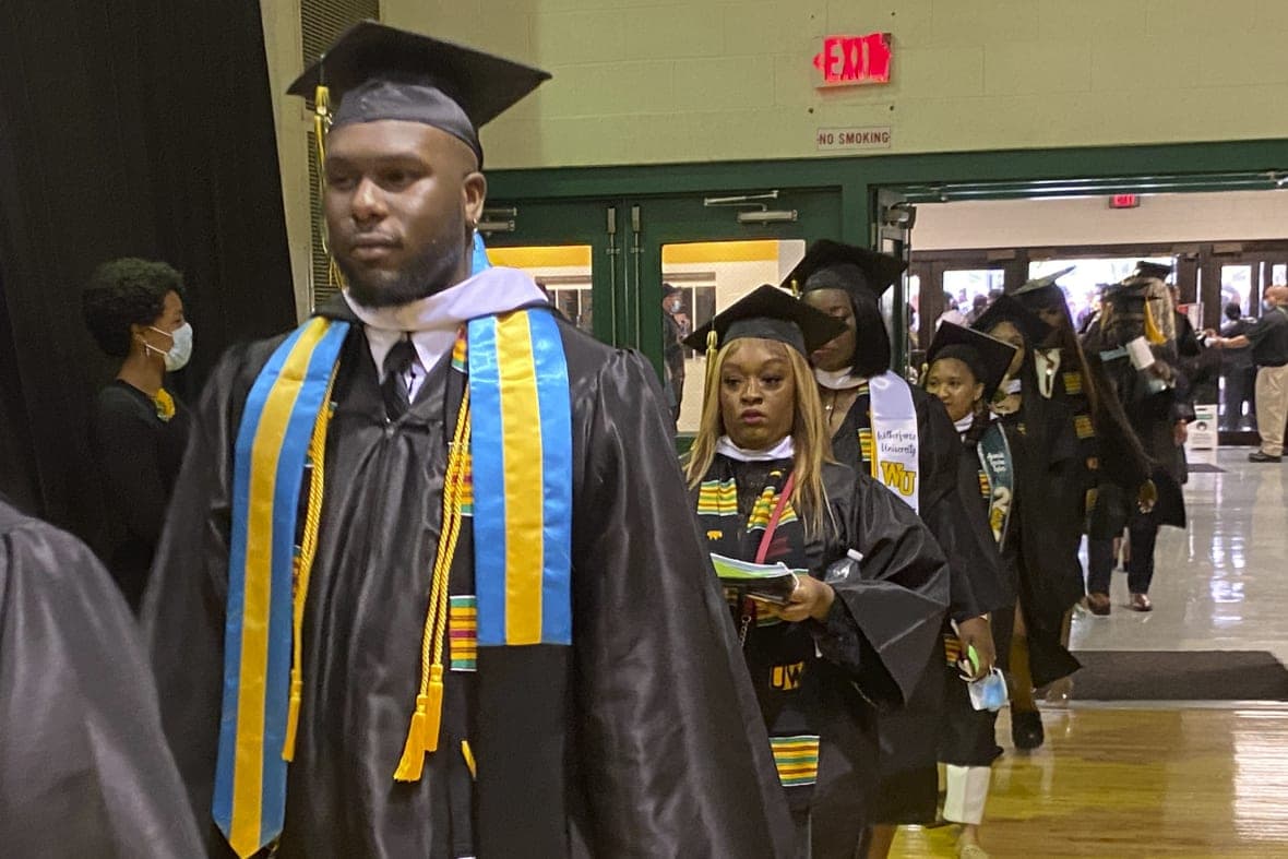 Wilberforce University graduates walk through the school