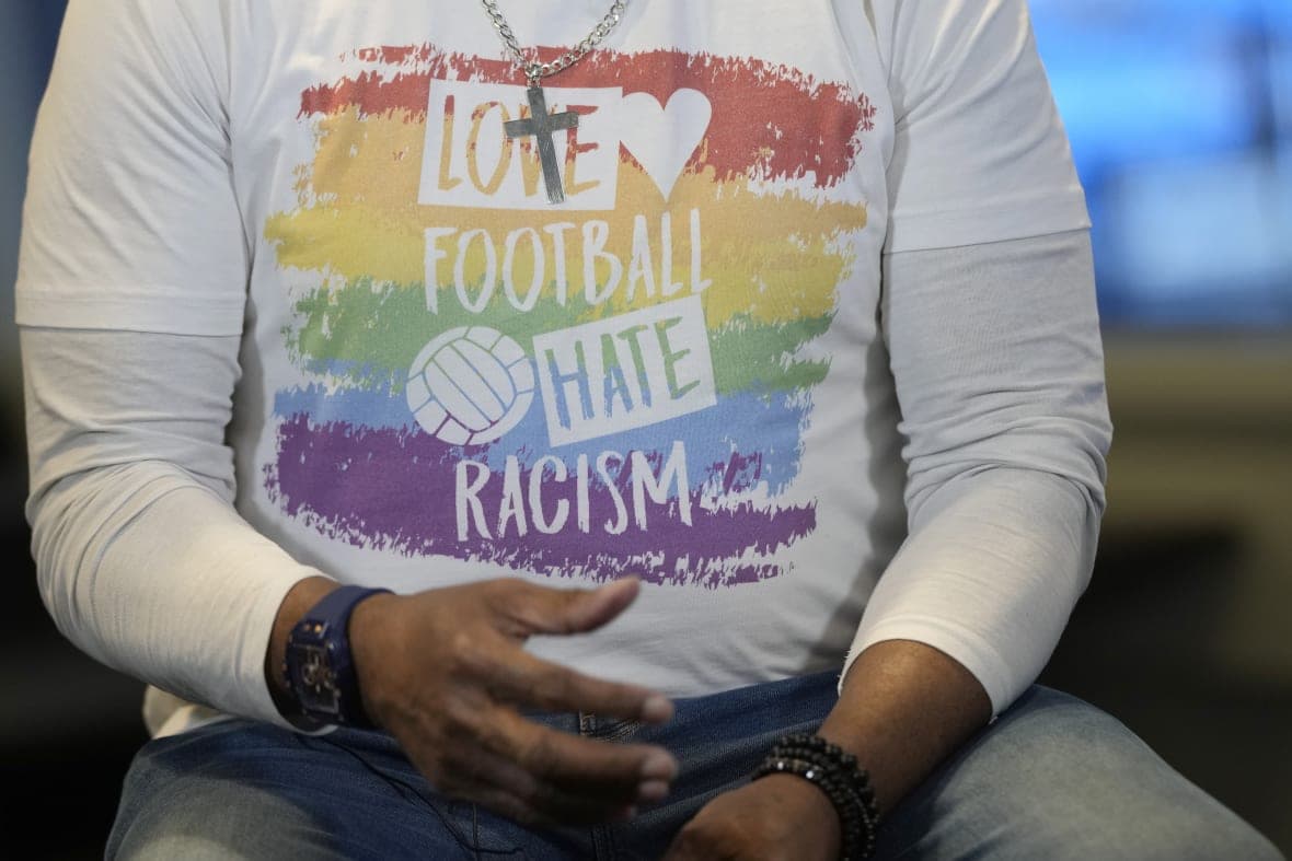 Anti-racism message on the T-shirt of former Chelsea soccer player Paul Canoville