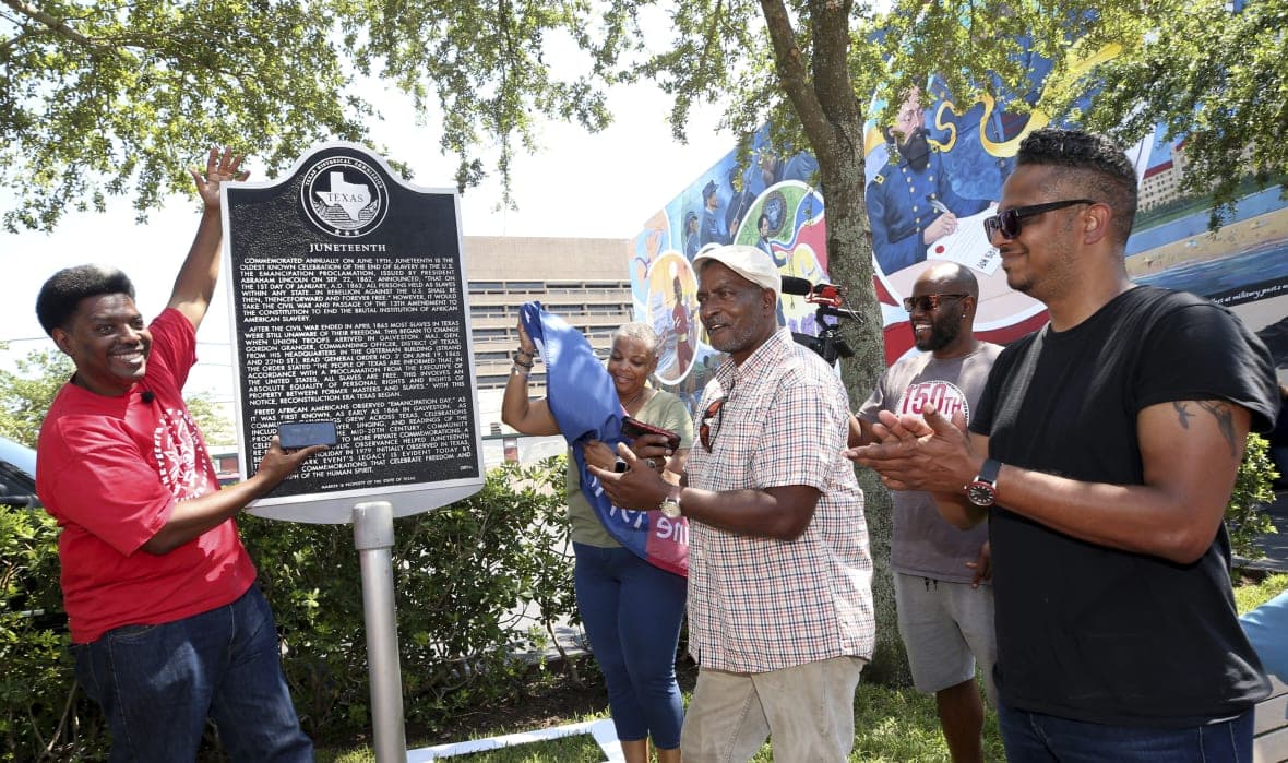 Sam Collins III and others celebrate at the Juneteenth historical marker