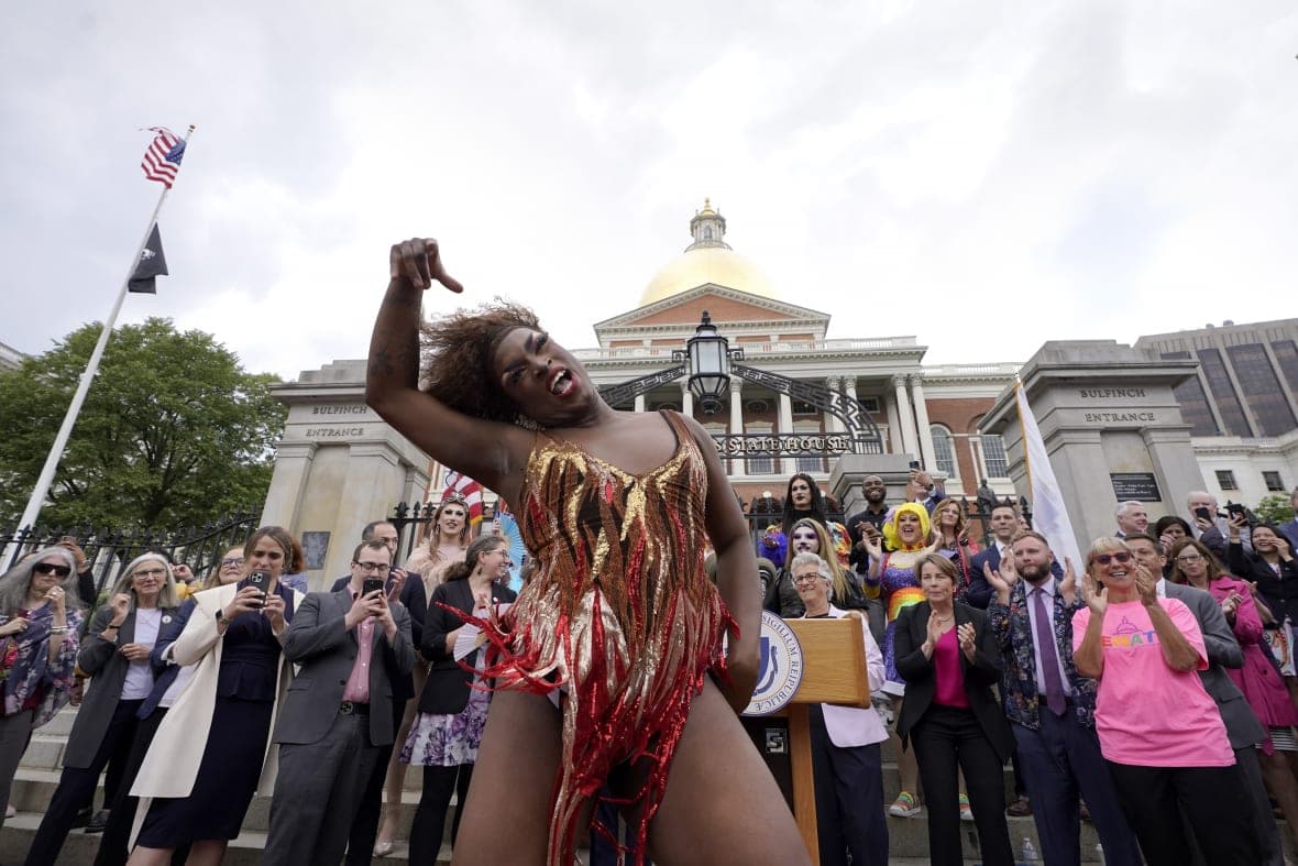 Drag performer Neon Calypso sings and dances