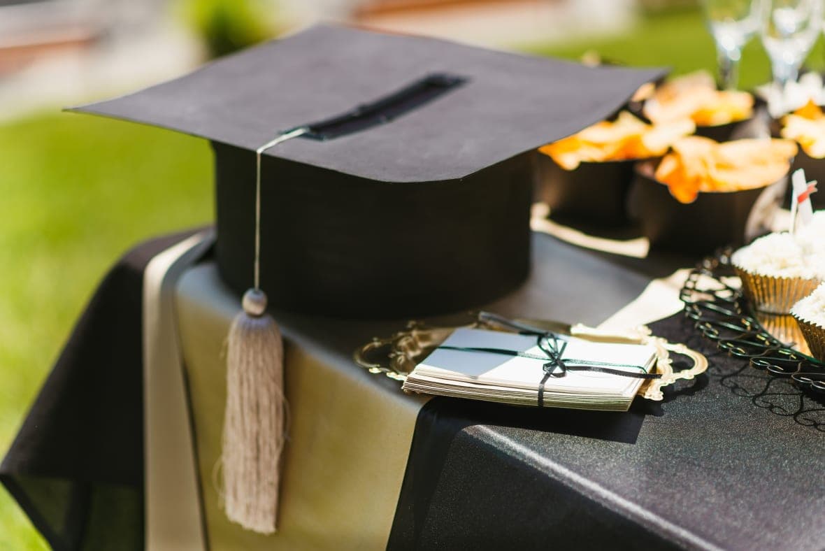 A black graduation cap on a table