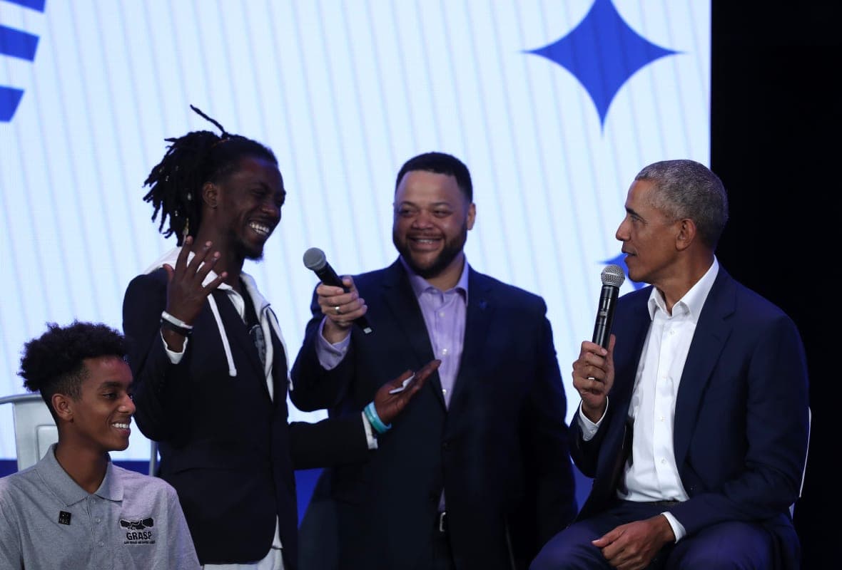 My Brother’s Keeper Alliance executive director Michael D. Smith, center, and former President Barack Obama